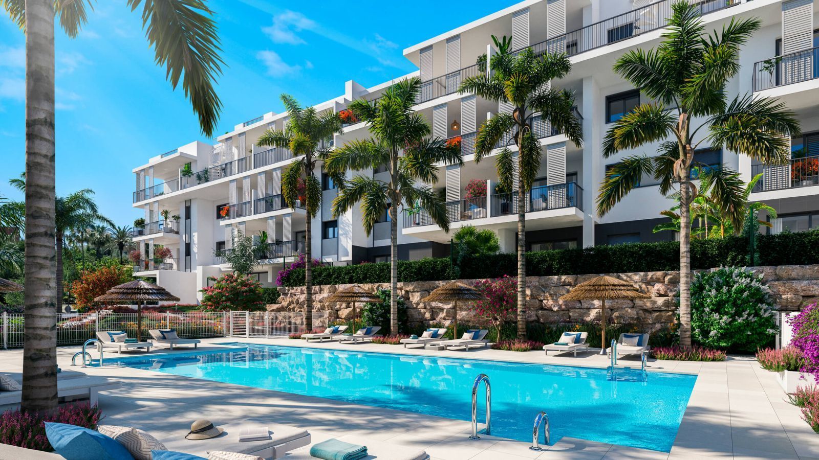 A modern apartment with a pool, palm trees, and ocean view.