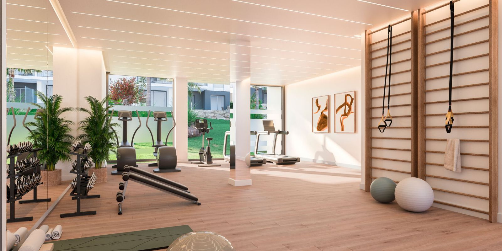Modern home gym with large windows, exercise equipment, and outdoor view.